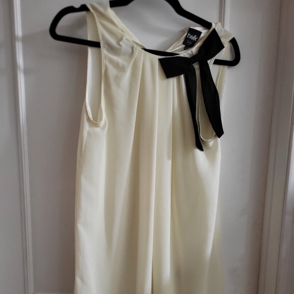 Twik Cream Sleeveless Chiffon Top with Oversized Black Shoulder Bow/Contrast Hem